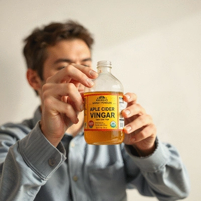 Lifestyle image of a person incorporating apple cider vinegar into their daily routine