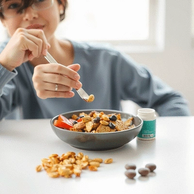 User enjoying a healthy meal with soluble fibre supplements